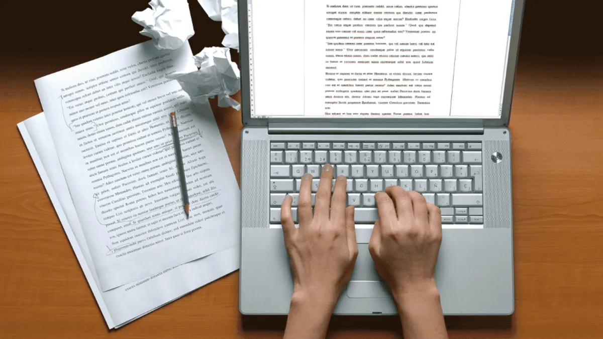 Content writer working on long form content with AI tools integrated in their writing workflow