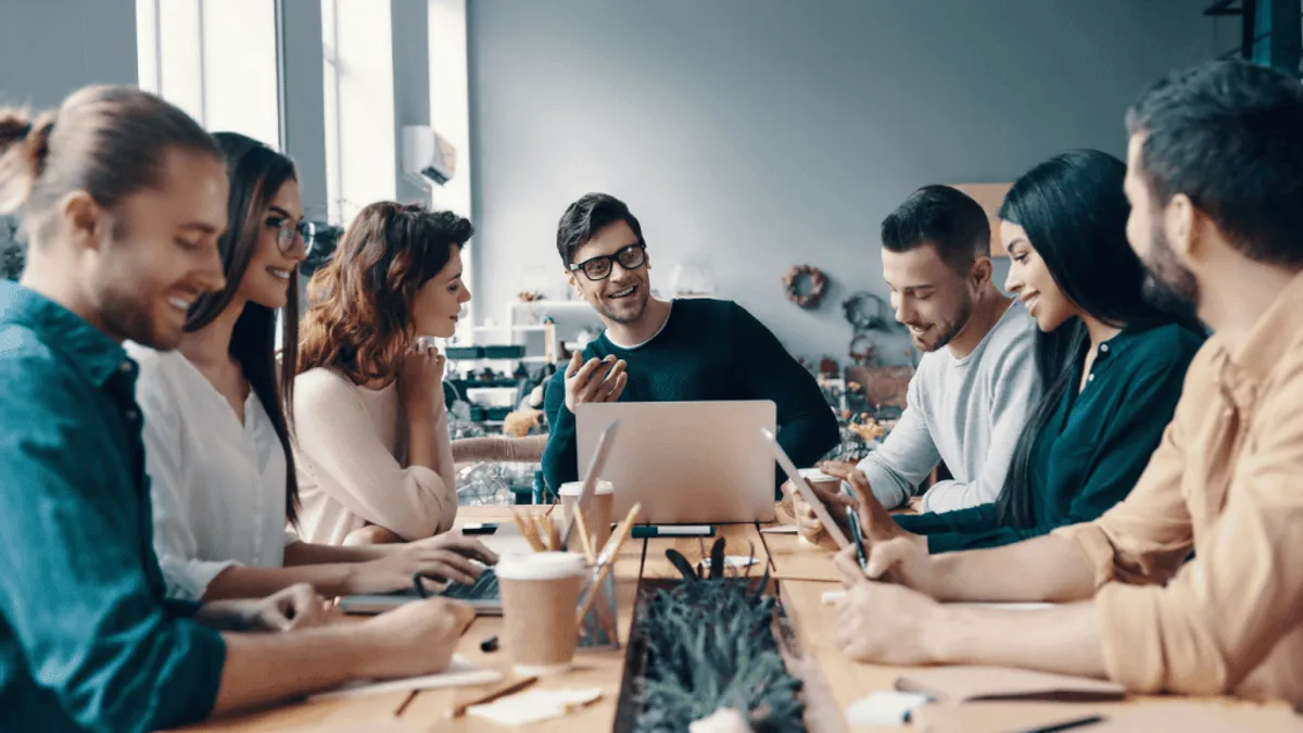 Marketing managers looking pleased with themselves and the team after reaping the benefits of AI