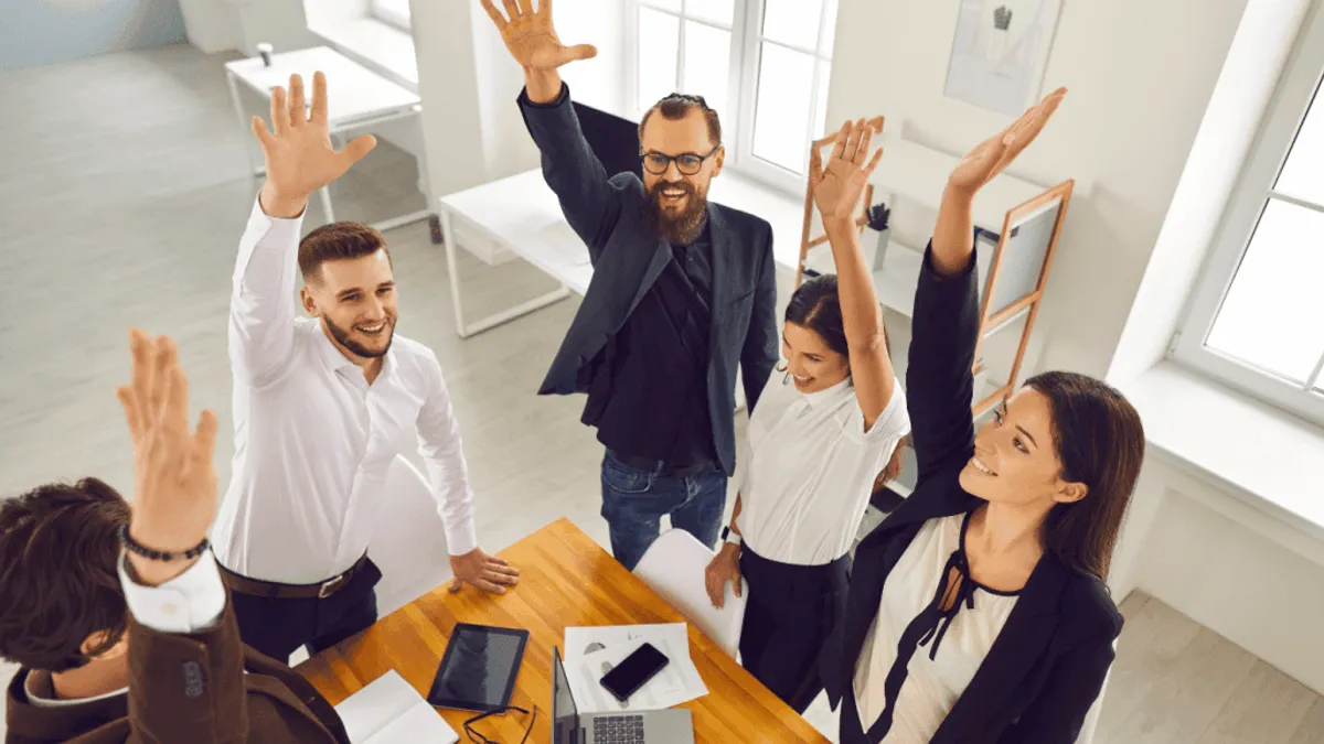 A sales team discussing the benefits of AI in sales training