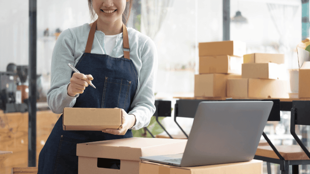 A person using a laptop to manage inventory of an ecommerce business