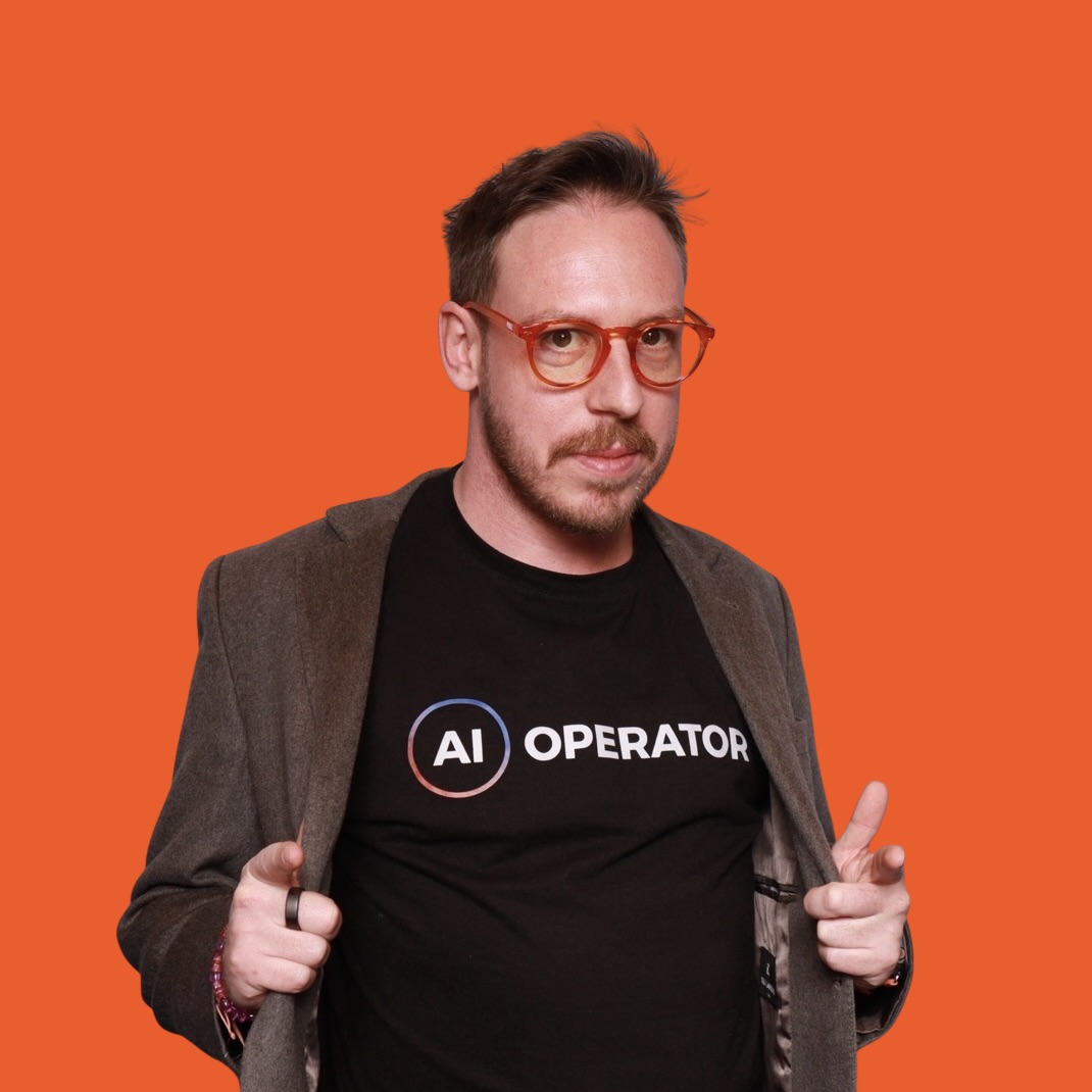Tim Cakir, CEO and Founder of AI Operator, wearing an AI Operator t-shirt against an orange background.